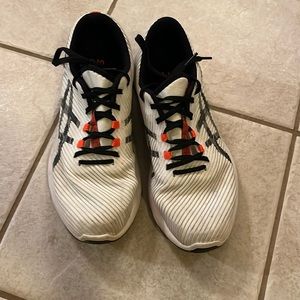 ASICS athletic shoes. In used condition